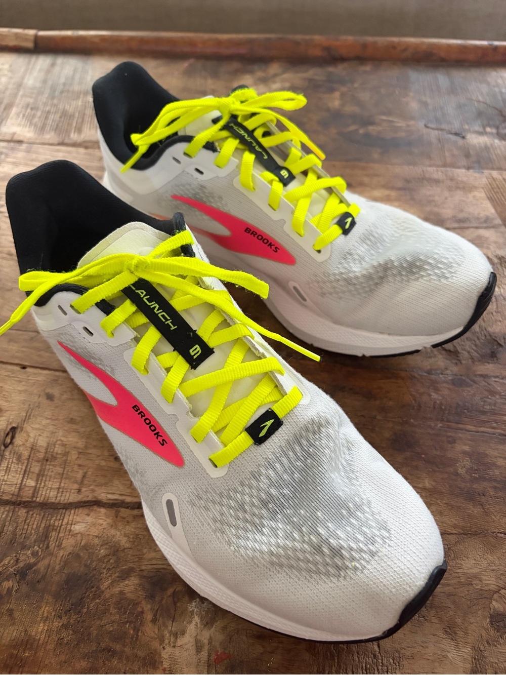 Brooks White Launch 9 Running Shoes with Neon Yellow Laces and Pink Accents